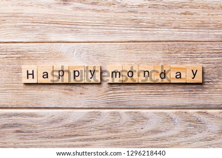 Happy Monday word written on wood block. Happy Monday text on wooden table for your desing, concept.