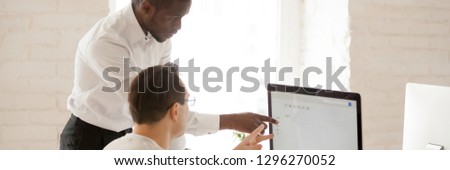 Horizontal image african team leader help colleague with computer task showing new corporate app, mentor teach intern concept horizontal photo banner for website header design with copy space for text