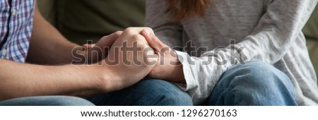Close up horizontal photo of couple in love holding hands loving wife supporting encouraging beloved husband show express sympathy. Understanding in relations concept banner for website header design Royalty-Free Stock Photo #1296270163