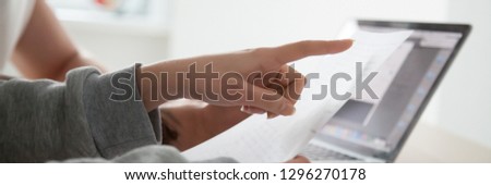 Close up woman holds document paper pay attention on contract point, analyzing mortgage loan or insurance conditions, learn agreement clauses, banner for website header design with copy space for text