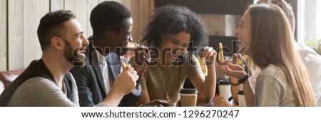 Five friends drinking coffee eating pizza at cafe, diverse people laughing tell jokes having fun in public place, multiracial friendship free time concept, horizontal banner for website header design