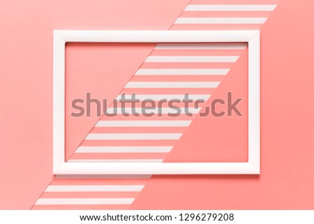 Abstract geometrical living coral pantone color flat lay background. Minimalism, geometry and symmetry template with empty picture frame mock up.