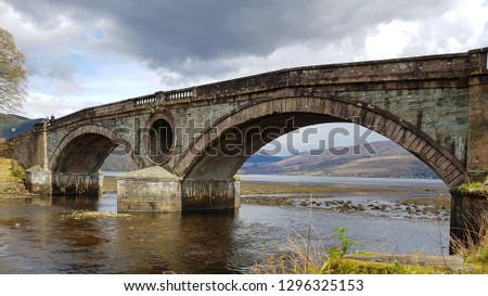Historic bridge at Inveraray, with the Scottish nature in the background.