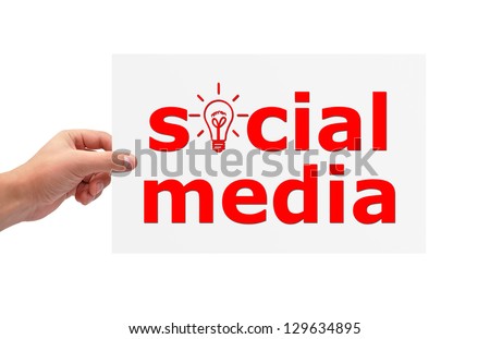 Hand holding paper with social media