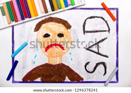 Colorful drawing: Crying sad man and word SAD