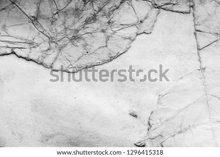 Aged paper sheet. Blank old background with dust and dirty stains. Vintage and antique art concept. Detailed closeup studio shot. Front view. Toned