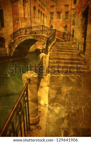 vintage style picture of a typical view at a canal in Venice