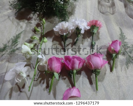 Picture showcasing white orchids, white gardenias and pink roses