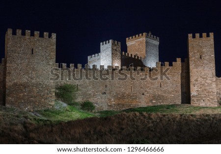 Night landscape. Ancient fortress in the mountains. Architectural monument. Heritage of ancestors. Tourist attraction.
