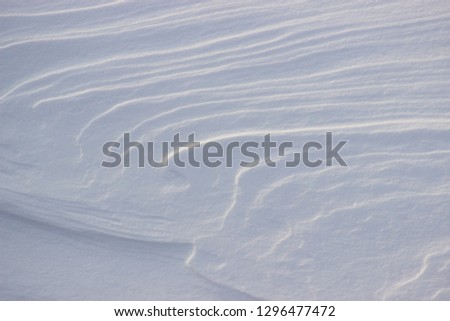 Snow patterns made by wind
