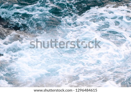 Sea water foam, top view, abstract nature background.