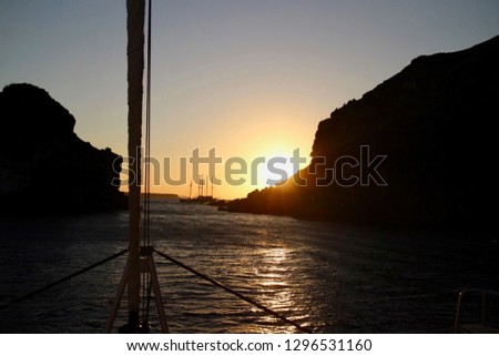 View from boat in the sunset. Santorini, Grece
