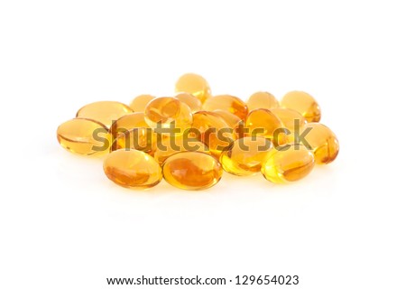 Vitamin E supplement capsules closeup on a white background Royalty-Free Stock Photo #129654023