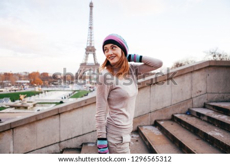 Beautiful girl posing near the eiffel tower