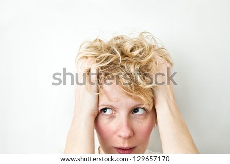 Blond Girl Pulling Hairs and looking left