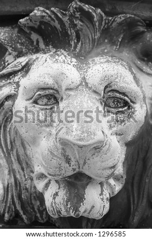 Close-up of lion's head statue outside state capitol building