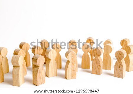 A crowd of wooden figures of people on a white background. Social survey and public opinion, the electorate. Population and citizens. Human resource, search for candidates for work. Royalty-Free Stock Photo #1296598447