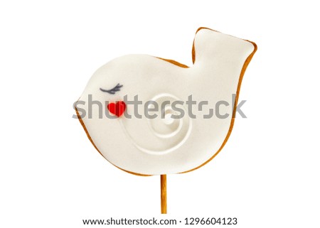 Closeup gingerbread pigeon bird cookie isolated at white background.