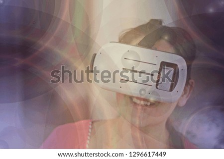 Happy woman getting experience using VR headset glasses of virtual reality at home- Image