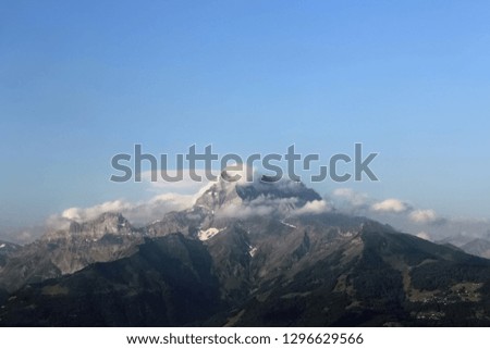 view of a cloudy mountain peak