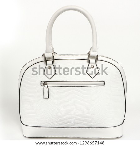 Women's stylish fashion accessories. Leather woman handbag on white background. Beautiful elegance and luxury fashion photo bag isolated.Closeup subject for blogging and site. High-res photo product.