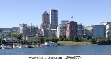 A panorama of Portland Oregon skyline and river.