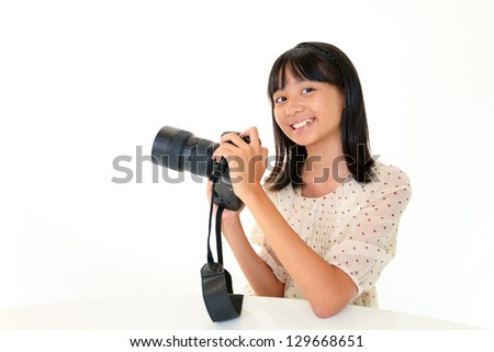 Child making photo using slr