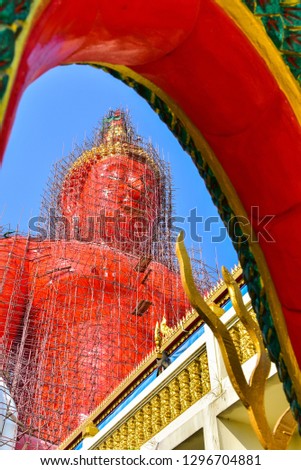 Construction of a large golden Buddha statue wat muang angthong, Thailand