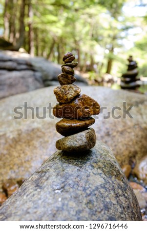 Balanced rocks on the edge of a stream