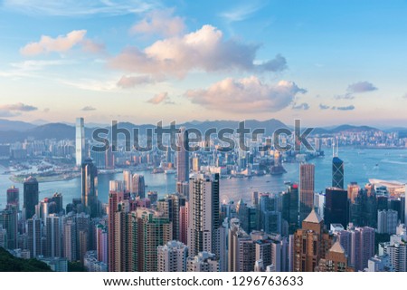 Victoria Harbor of Hong Kong city under sunset