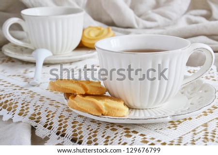 Tea party with cookies Royalty-Free Stock Photo #129676799