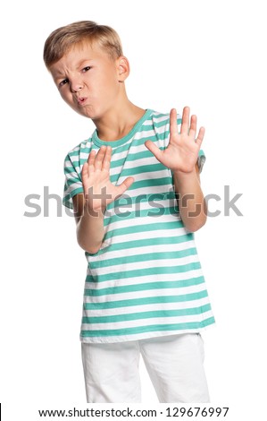 Portrait of teen boy with a look of horror and disgust, isolated on white background