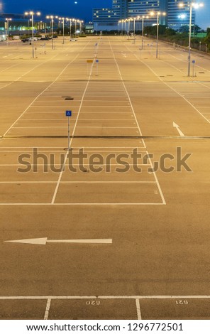 empty car park with urban background at night