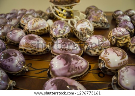 Souvenir cowrie shells with zodiac
