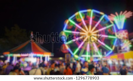 Temple fair colorful flag night party, Thai temple festival fair in blurred and de-focus Royalty-Free Stock Photo #1296778903