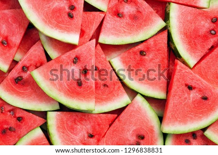 heap of fresh sliced watermelon as textured background Royalty-Free Stock Photo #1296838831