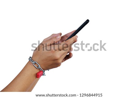 Hands and smartphone tied with metallic chain with padlock isolated on white background with clipping path. Social Disease - mobile phone addiction concept.
