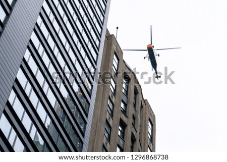 Helicopter hovering above skyscrapers in downtown Chicago - Chicago, Illinois, USA