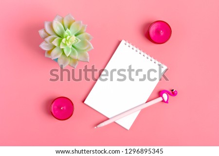 White notebook for notes, candle, pen - flamingo, home flower succulent on pink background Flat lay Top view Copy space Happy Valentine's day, Goals, Means, Resolution concept