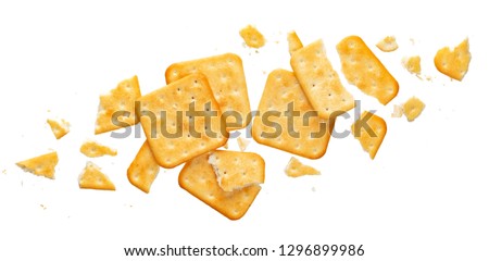 Broken cracker isolated on white background. Crushed dry cracker cookies isolated with clipping path, top view Royalty-Free Stock Photo #1296899986