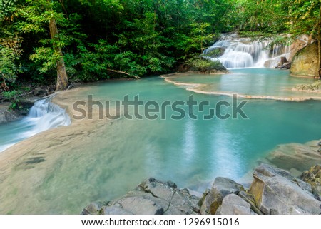 beautiful waterfall in the forest. Tropical and landscape. Travel and vacation at Thailand.