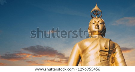 Wat Tham Seua or Tiger Cave Temple mountain top golden Buddha statue