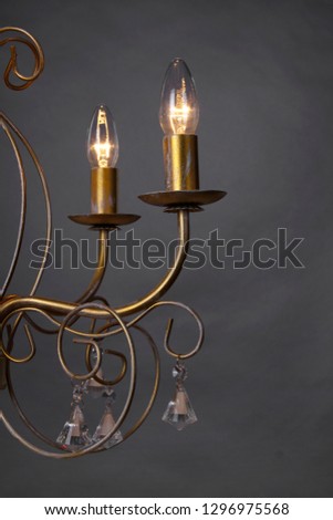Chandelier isolated on black background Royalty-Free Stock Photo #1296975568