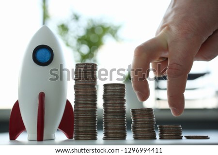 Rocketship stand with coin row ready go to moon closeup. Stock market modern background banner earning currency exchange analytic bank asset deposit contribution increase capital space travel concept