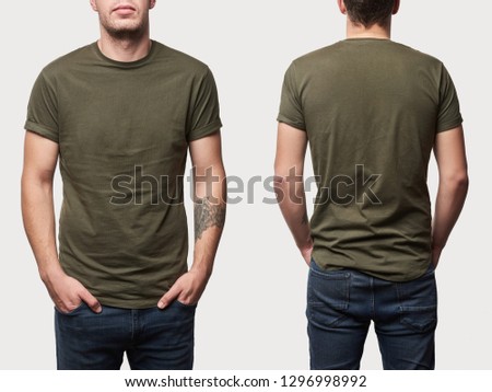 cropped view of tattooed man in basic khaki t-shirt with copy space isolated on white Royalty-Free Stock Photo #1296998992