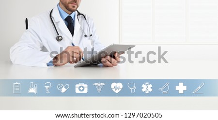 doctor at desk office write on digital tablet, with symbols and medical icons, web banner and copy space template