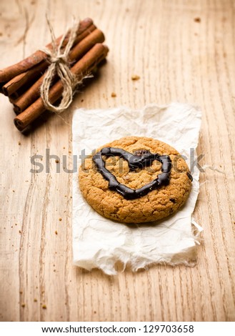 Oatmeal cookies with chocolate heart shape.