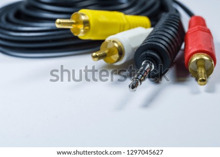 Hank of multi-colored plugs. Adapter. Tulips adapters for audiodevices. On a white background. The isolated object. 
