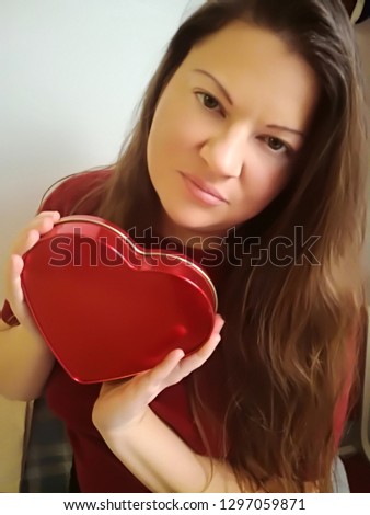 Redhead girl with gift for Valentines Day.