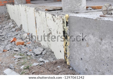 House concrete foundation insulation with stryfoam boards.